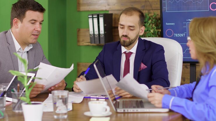 bearded-team-leader-business-suit-having-meeting-with-his-investment-team-young-leadership_482257-27922